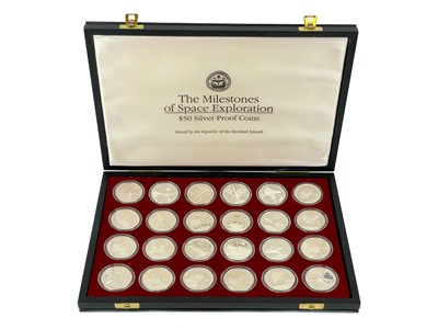 Lot 147 - "Milestones of Space Exploration" cased proof .999 silver crown sized 1 ounce $50 coins (x24)