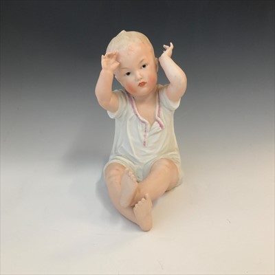 Lot 974 - An early 20th century bisque piano doll,...