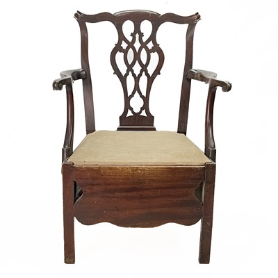 Lot 113 - A George III provincial mahogany commode chair.