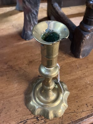 Lot 114 - An 18th century brass candlestick.