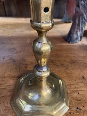 Lot 114 - An 18th century brass candlestick.