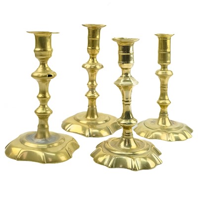 Lot 250 - A matched pair of 18th century brass candlesticks.