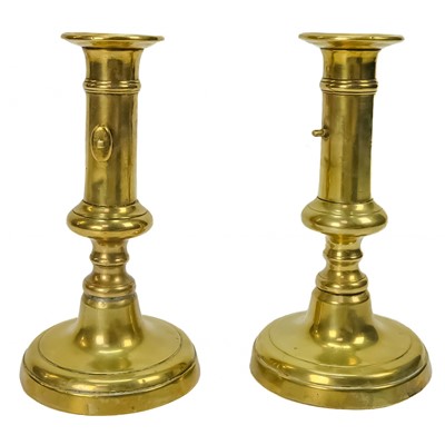 Lot 282 - A pair of 19th century brass candlesticks.