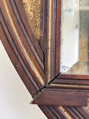 Lot 70 - An Aesthetic Movement mahogany oval frame wall mirror.