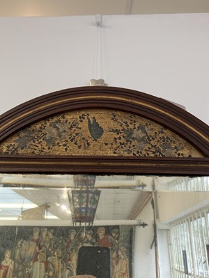 Lot 70 - An Aesthetic Movement mahogany oval frame wall mirror.