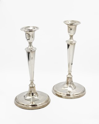 Lot 136 - An Edwardian silver good pair of candlesticks by Fordham & Faulkner.