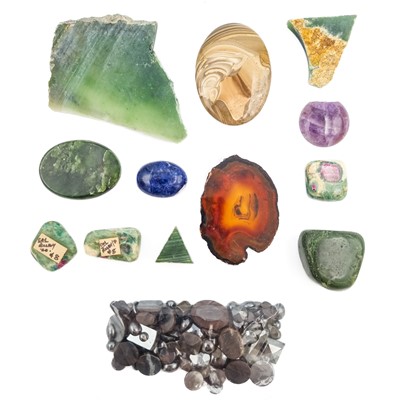 Lot 323 - A large quantity of cut hematite stones with agate and uncut jadeite.