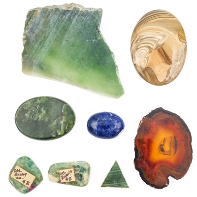 Lot 323 - A large quantity of cut hematite stones with agate and uncut jadeite.