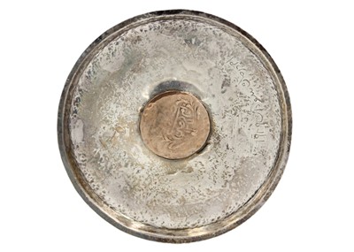 Lot 13 - A pair of Islamic silver .800 coin dishes.