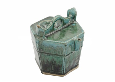 Lot 43 - A Chinese Shiwan pottery green-glazed teapot, 19th century.