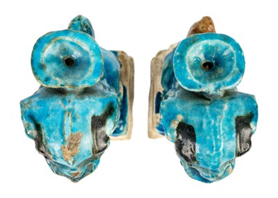 Lot 44 - Two Chinese turquoise pottery dogs of fo joss stick holders, Ming Dynasty.