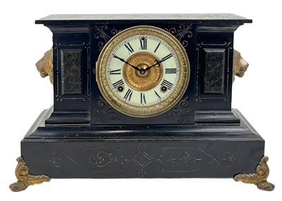 Lot 372 - An American Ansonia black lacquered iron mantel clock.