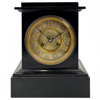 Lot 383 - A black slate French eight day mantel clock.