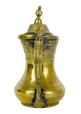 Lot 69 - A Saudi Arabian brass dallah pot, 19th century.