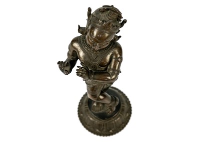 Lot 35 - An Indian bronze figure of dancing Krishna.