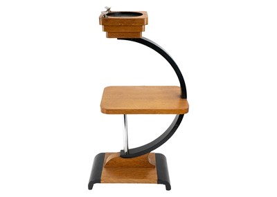 Lot 586 - An Art Deco oak and ebonised tiered stand.