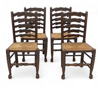 Lot 1221 - A set of four ladderback chairs.