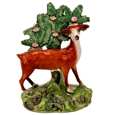 Lot 402 - A Staffordshire pottery bocage figure of a deer.