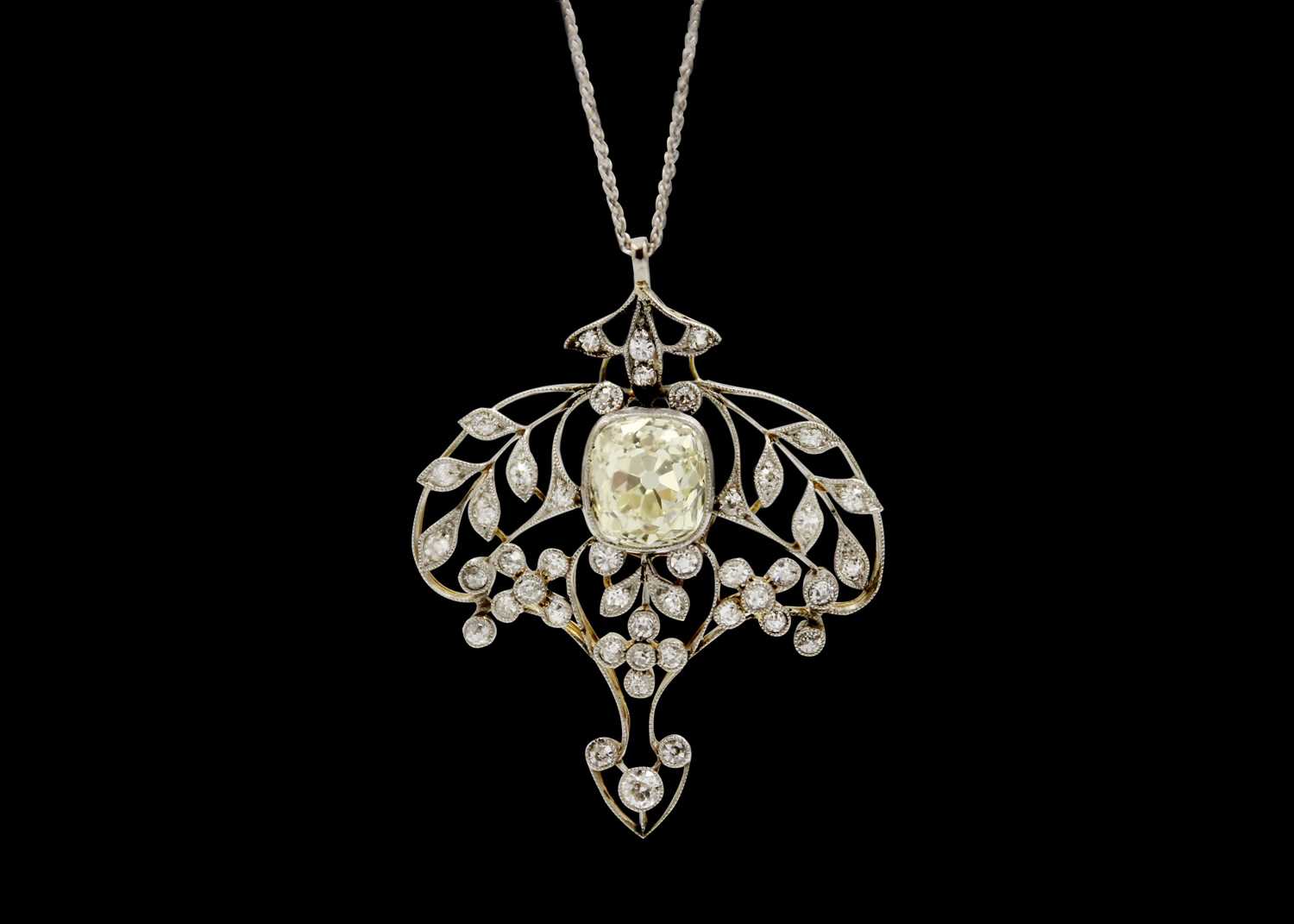 Lot 32 - An exquisite Belle Époque diamond pendant with certified Old Mine cut 3.97ct light yellow diamond.