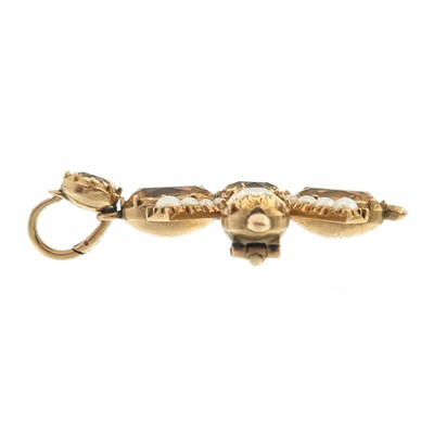 Lot 110 - A Georgian gold foil back topaz and split pearl cross pendant brooch.