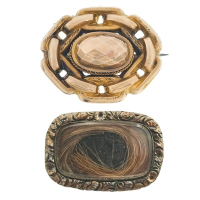 Lot 63 - A Victorian gold (tests 14ct) oval brooch and a gold mourning brooch.