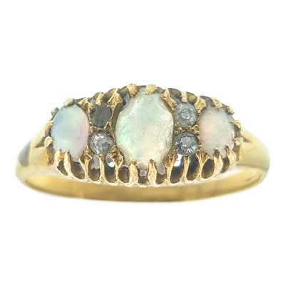 Lot 64 - A Victorian high purity gold (tests 18ct) opal and diamond set ring.