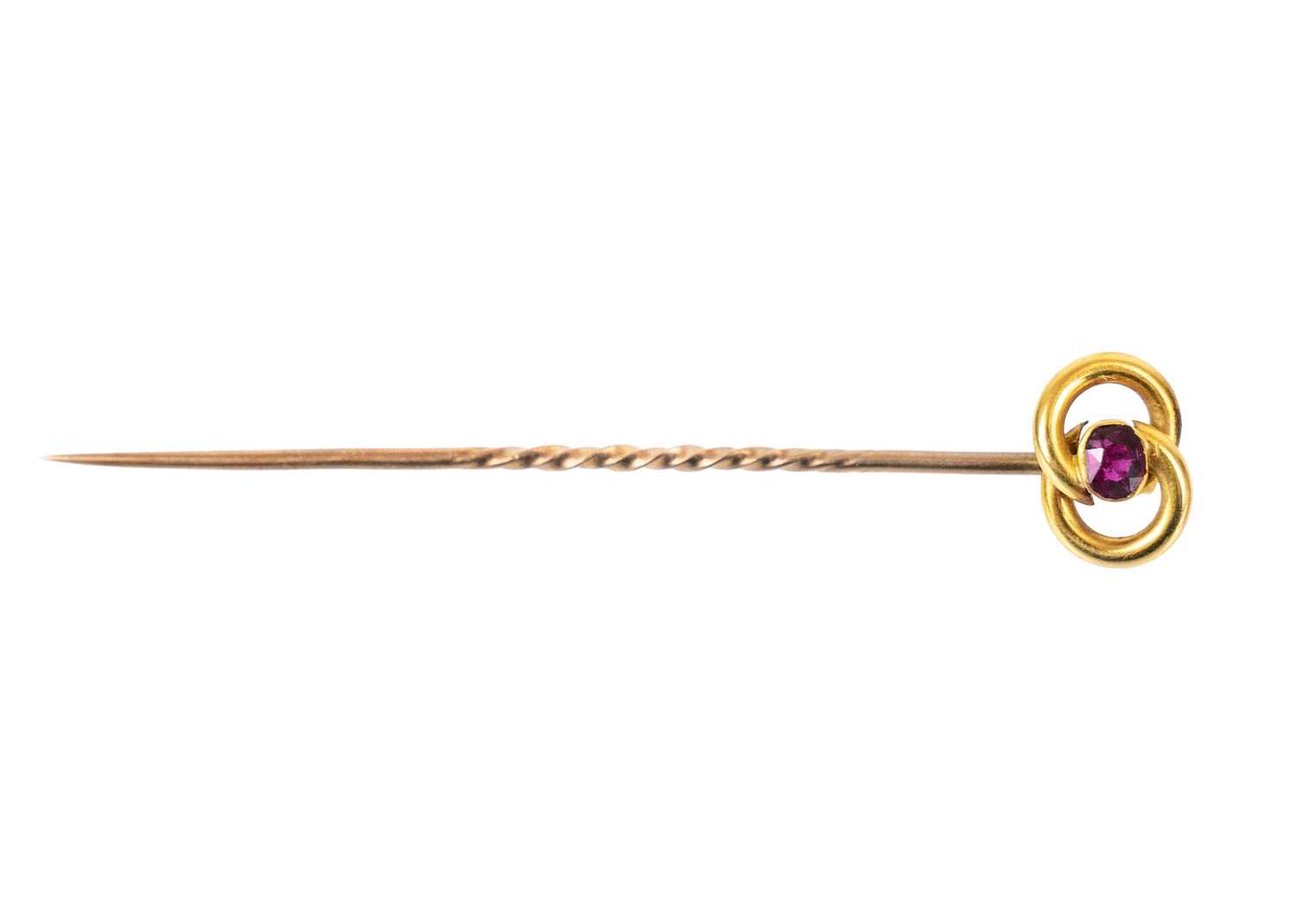 Lot 68 - A 15ct tie pin set with a small oval cut ruby.