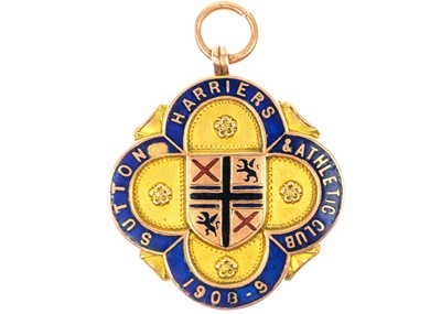 Lot 84 - An Edwardian 9ct rose gold and enamel shield watch fob by Vaughton Birmingham.