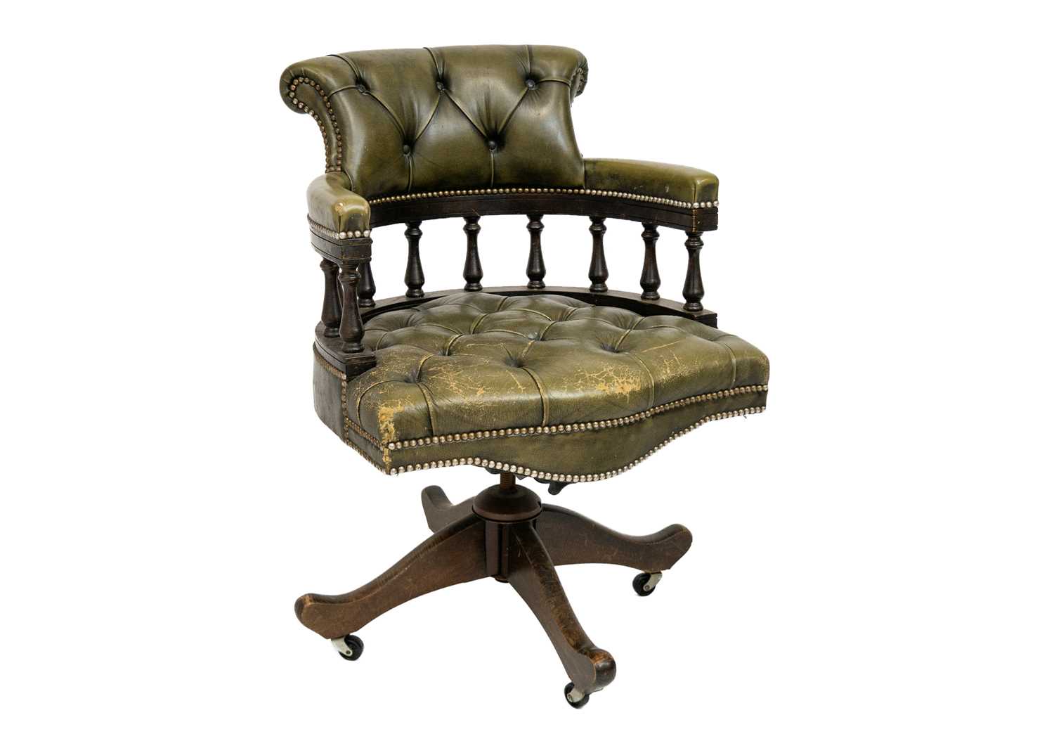 Lot 65 - A button backed green leather captain's swivel chair.