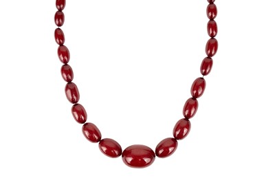 Lot 346 - A cherry bakelite amber graduated oval bead necklace.