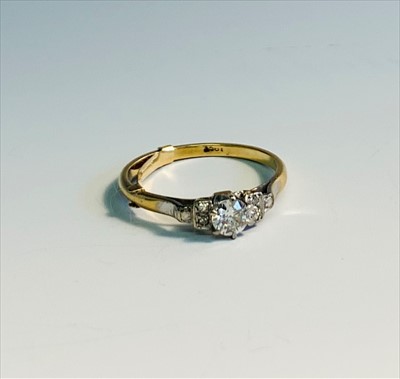 Lot 2578 - An 18ct gold and platinum ring set a diamond...