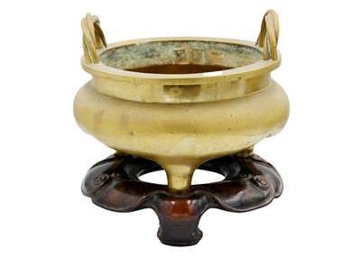 Lot 66 - A large Chinese bronze twin-handled tripod censer on stand, Qing Dynasty.