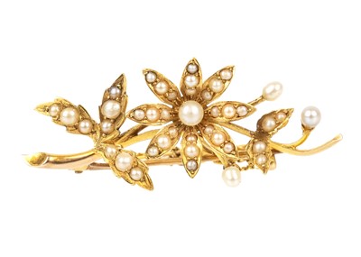 Lot 81 - A high-purity gold (estimated 18ct) pearl set floral brooch.