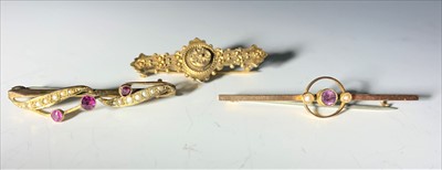 Lot 2583 - A 15ct gold bar brooch and two 9ct bar brooches.