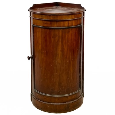 Lot 123 - A George III mahogany bow front corner pot cupboard.