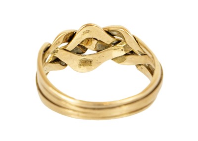 Lot 96 - An 18ct four piece puzzle ring of knot design.