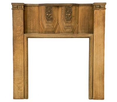 Lot 34 - An Art Deco French walnut carved fire surround.