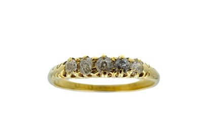 Lot 101 - An 18ct diamond set five stone ring.