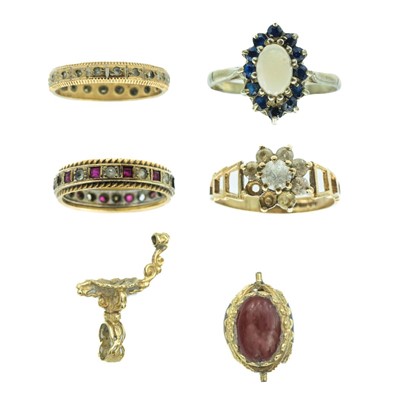 Lot 107 - A selection of four 9ct gem set rings and a broken swivel fob.