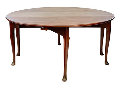 Lot 132 - An early George III mahogany large oval drop leaf dining table.