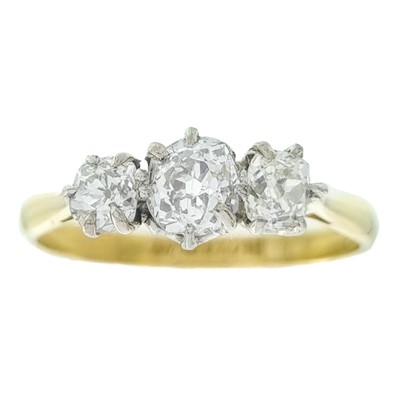 Lot 117 - An 18ct and platinum diamond set three-stone ring.