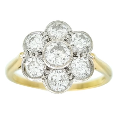 Lot 266 - An 18ct diamond flower head diamond set seven stone ring.