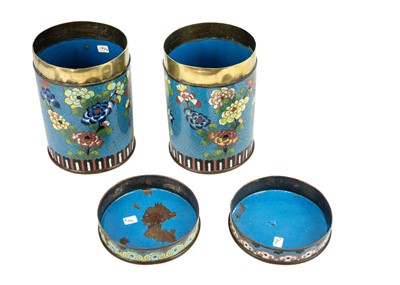 Lot 58 - A pair of Chinese cloisonne cylindrical jars and covers, early 19th century.