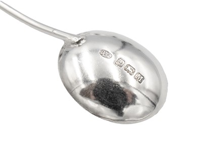 Lot 154 - A silver set of six coffee bean spoons and a set of four silver shell pattern coffee spoons.