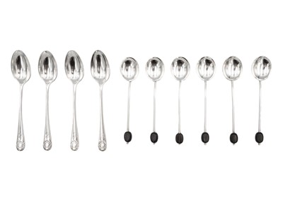 Lot 154 - A silver set of six coffee bean spoons and a set of four silver shell pattern coffee spoons.