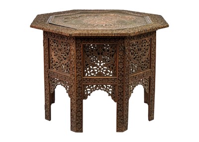 Lot 102 - An Anglo Indian carved wood folding occasional table.