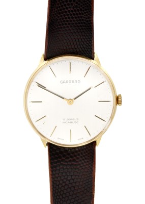 Lot 104 - GARRARD - A gentleman's manual wind gold-plated wristwatch.