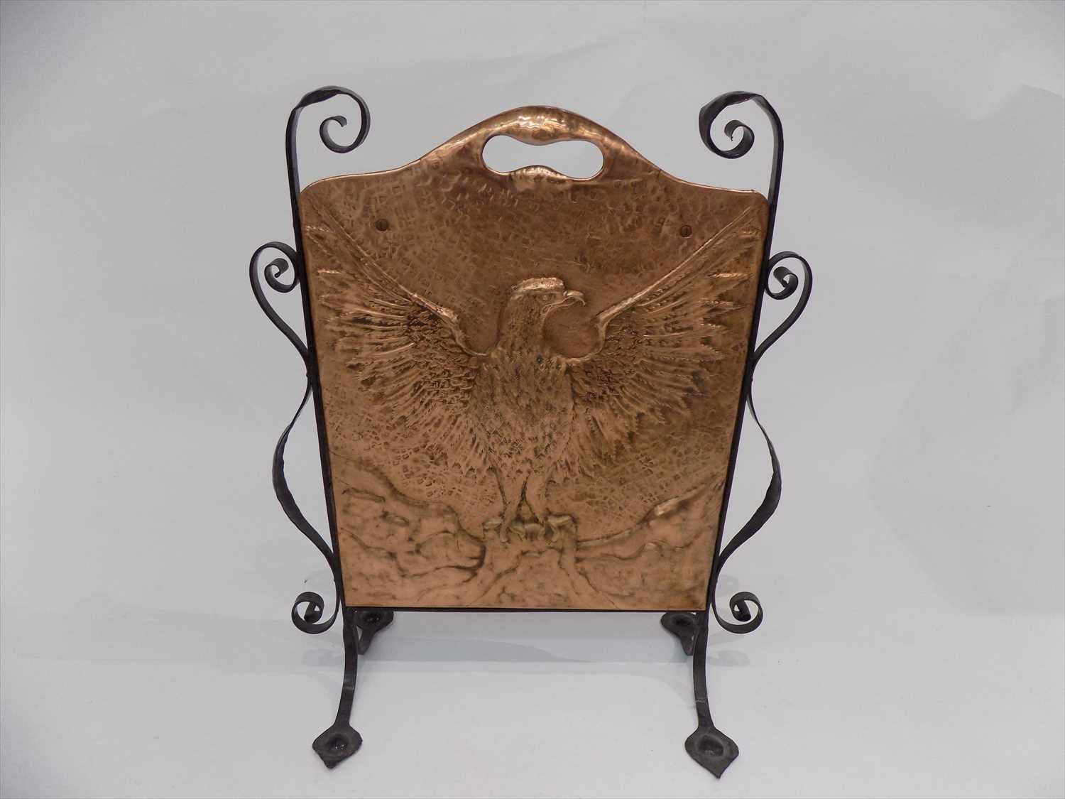 Lot 70 - A copper and wrought metal fire screen with...