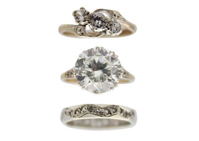 Lot 138 - Three 9ct white stone set dress rings.