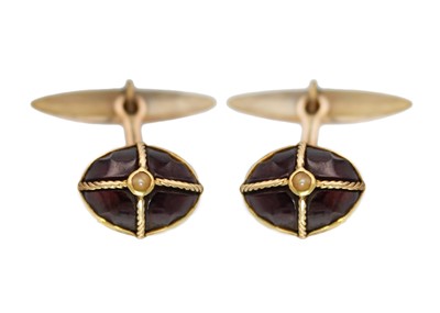 Lot 139 - A pair of 15ct garnet and seed pearl set cufflinks.